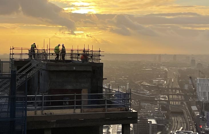 Firework display team working at the top of a building in London.